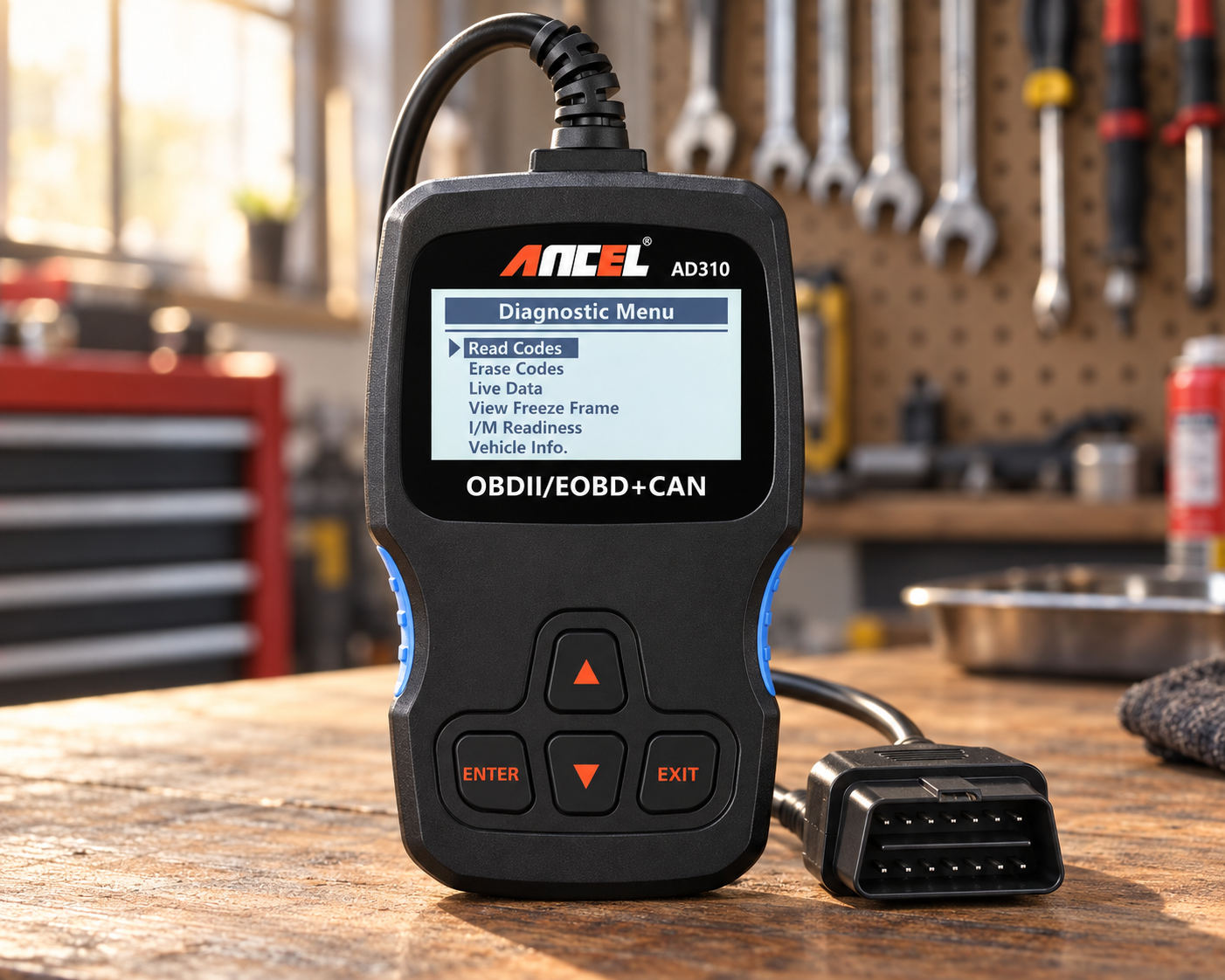 ANCEL AD310 OBD2 code reader with 16-pin connector on a wooden automotive workshop bench