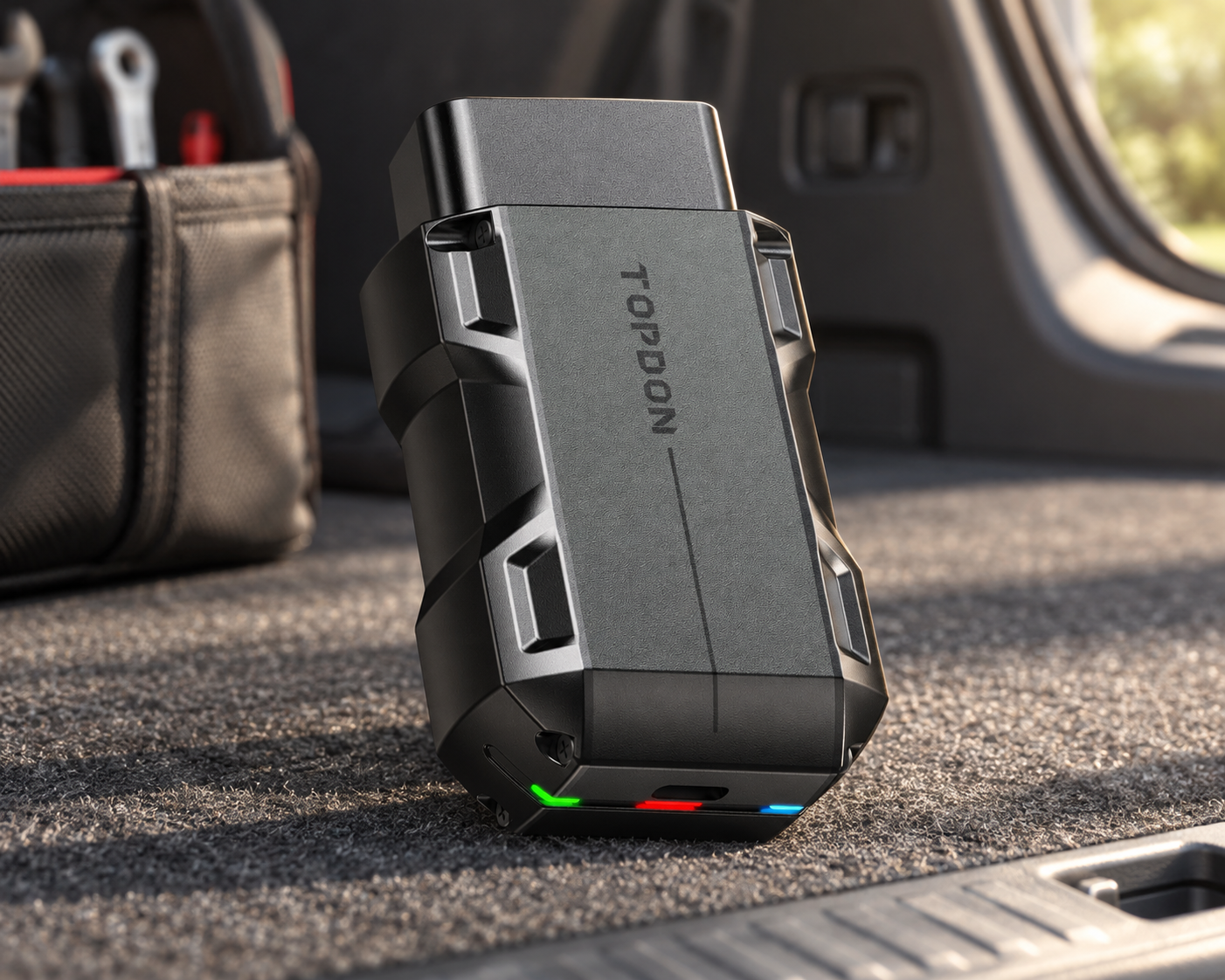 TOPDON TopScan Pro diagnostic device in an SUV cargo area beside a soft tool organizer