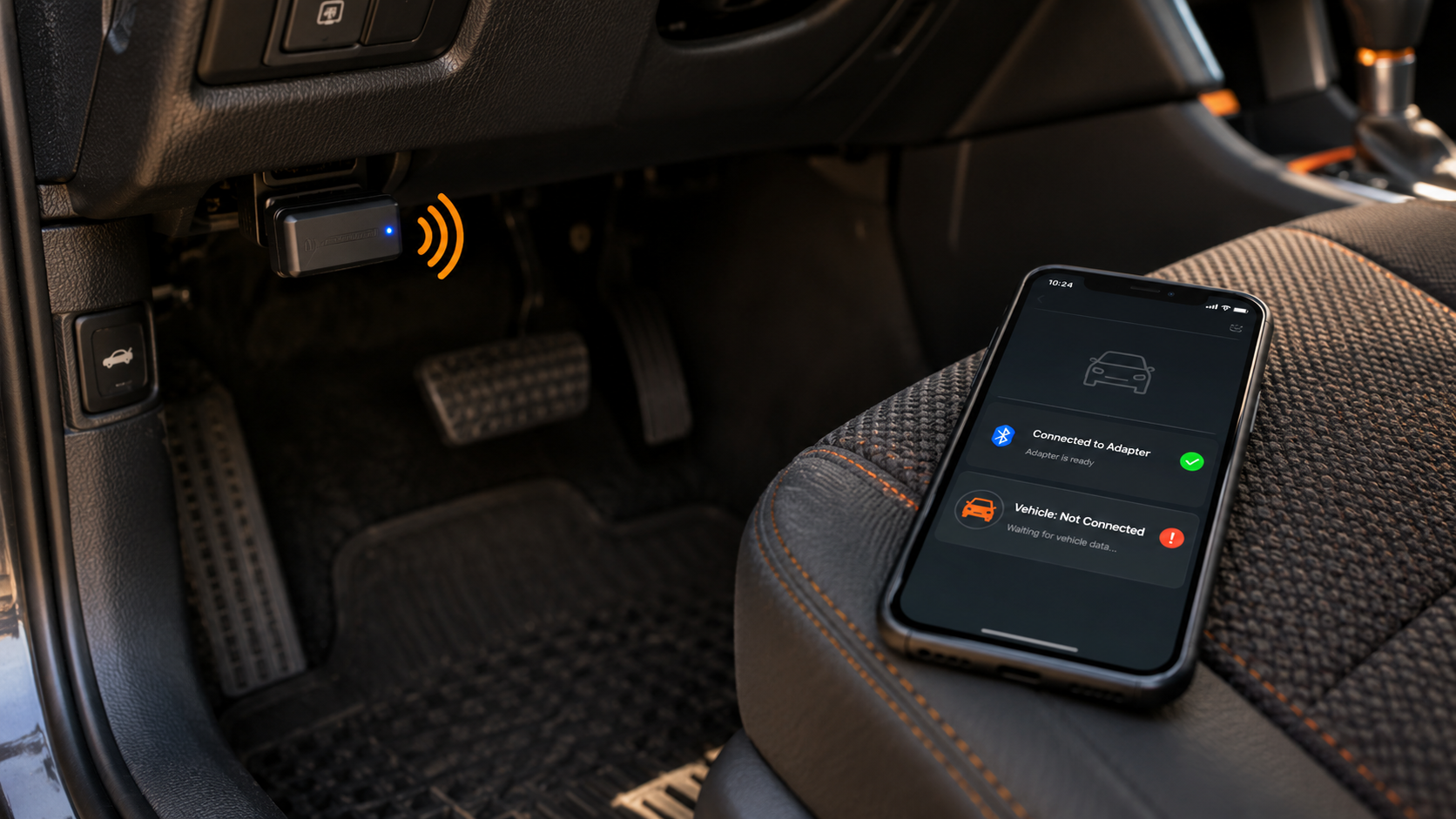 Bluetooth OBD2 adapter under the dashboard while a phone on the seat shows connected to adapter but not to the vehicle.